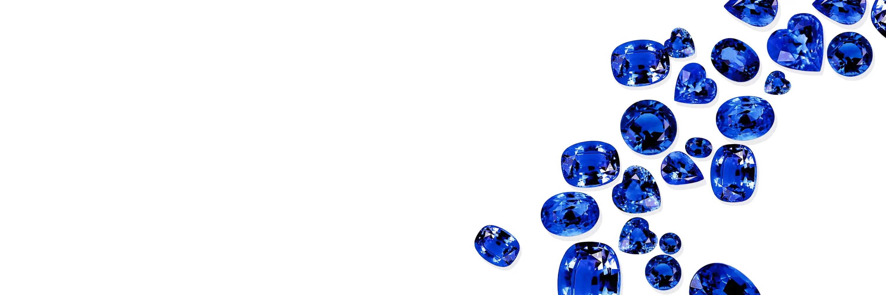 Blue Sapphire scattered on a white background