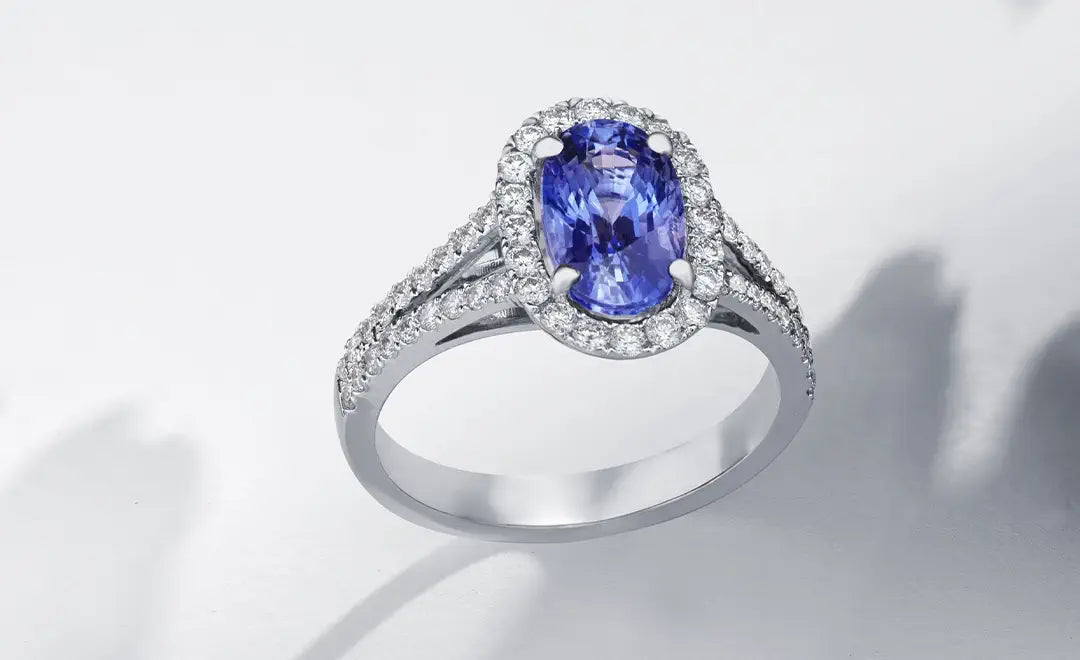 Blue Sapphire & Diamond Ring on a light gray background